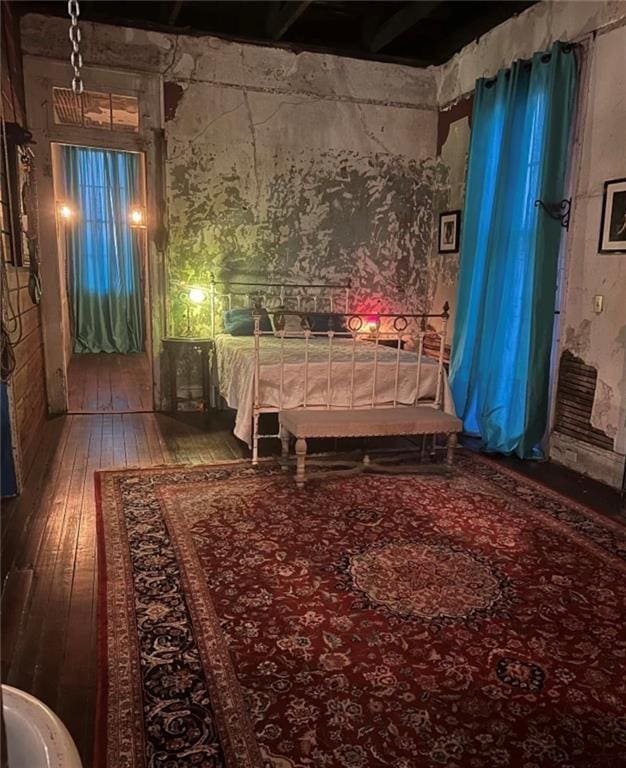 unfurnished bedroom featuring wood-type flooring