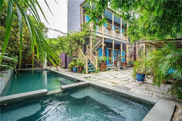 view of pool featuring an in ground hot tub and a patio