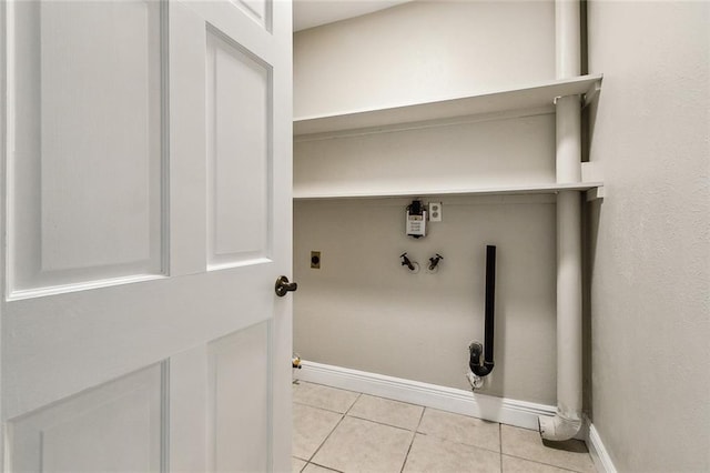 laundry room with washer hookup, gas dryer hookup, light tile patterned flooring, and electric dryer hookup