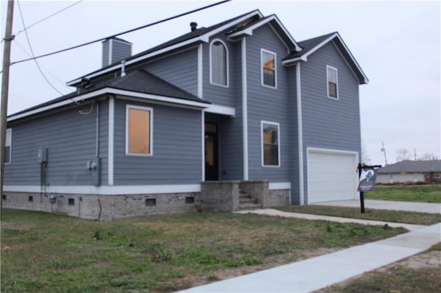 view of front of property with a garage