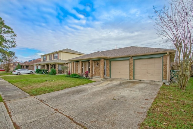 view of front facade with a front yard and a garage