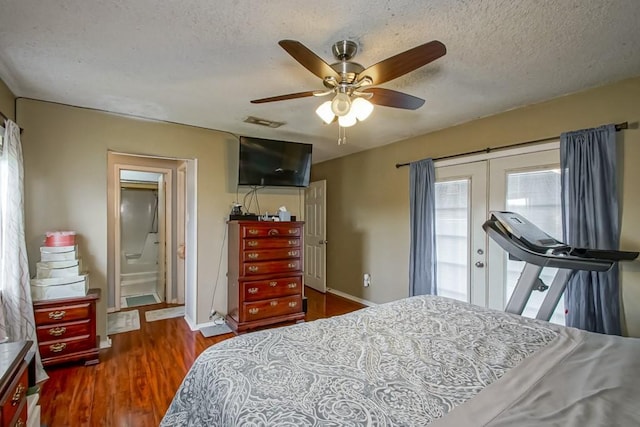 bedroom featuring ceiling fan, dark wood-type flooring, french doors, and a textured ceiling