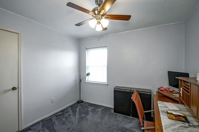 carpeted office featuring ceiling fan