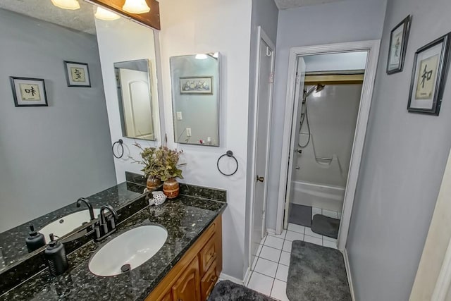 bathroom with vanity, tile patterned flooring, and walk in shower