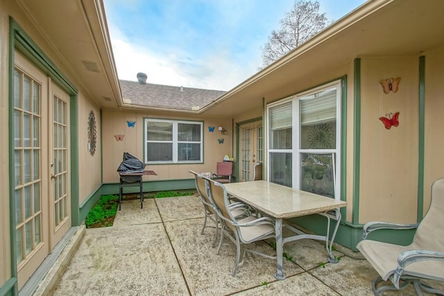 view of patio featuring french doors