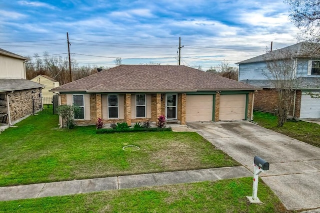 ranch-style home featuring a front lawn and a garage