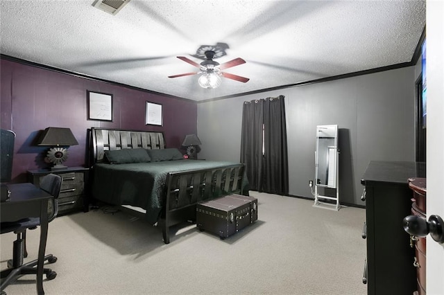 carpeted bedroom featuring ornamental molding, a textured ceiling, and ceiling fan