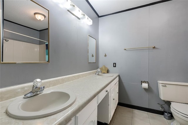 bathroom featuring toilet, tile patterned flooring, and vanity