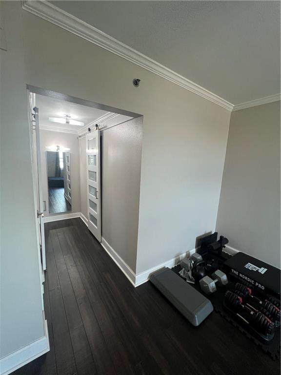 corridor with dark wood-type flooring and ornamental molding