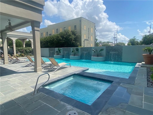 1205 St Charles Ave Unit 1101, New Orleans, LA 70130 - view of swimming pool with a patio and an in-ground hot tub