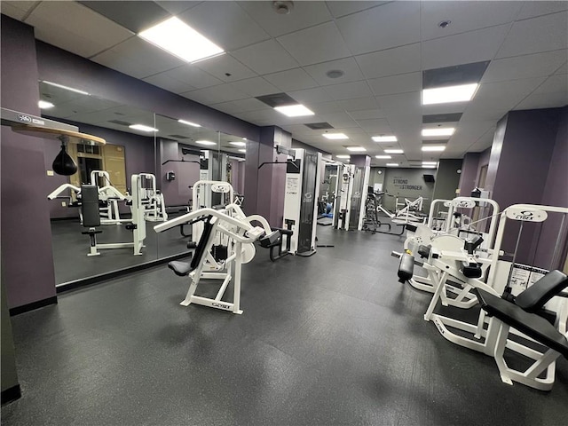 gym featuring a drop ceiling