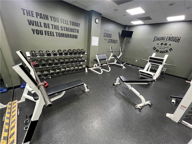 workout area featuring a drop ceiling