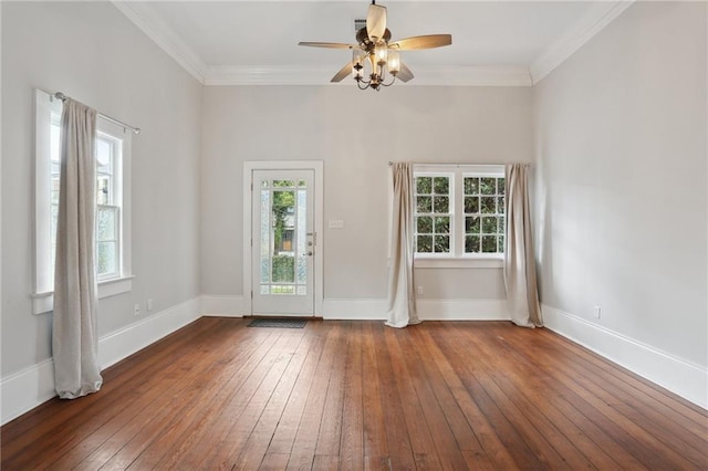 unfurnished room with ceiling fan, crown molding, and dark wood-type flooring