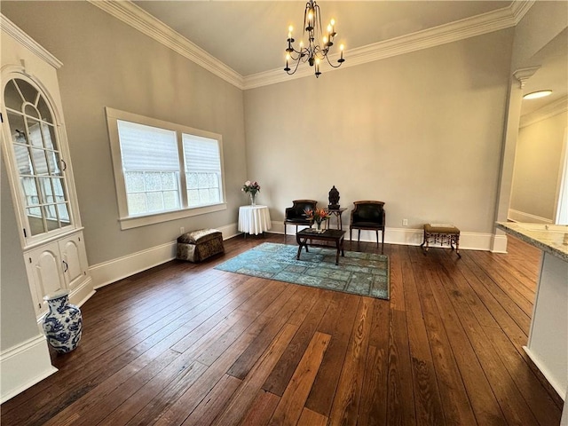 living area with an inviting chandelier, dark hardwood / wood-style floors, and crown molding