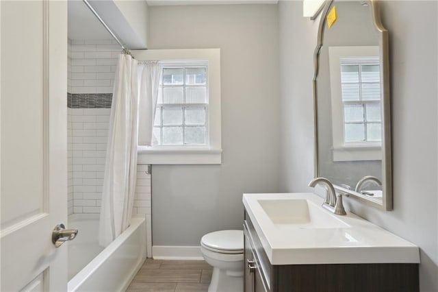 full bathroom with vanity, toilet, and shower / tub combo