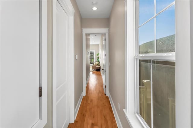 corridor featuring a mountain view and light hardwood / wood-style floors