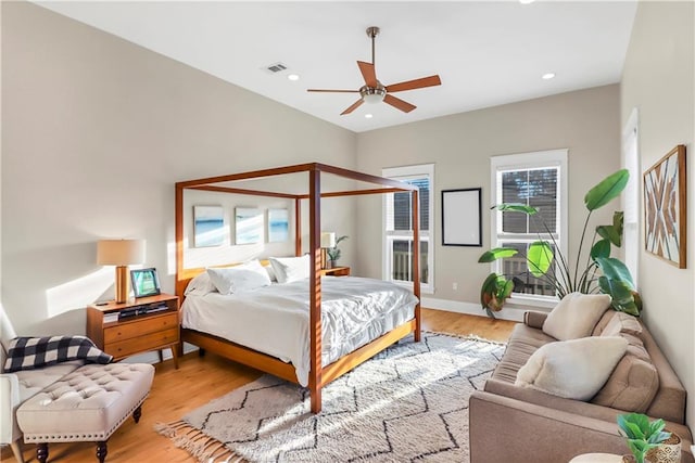 bedroom with ceiling fan and light hardwood / wood-style floors