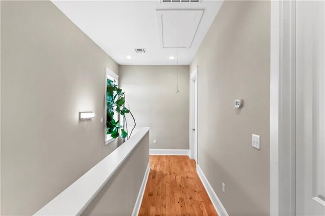 corridor featuring light hardwood / wood-style floors