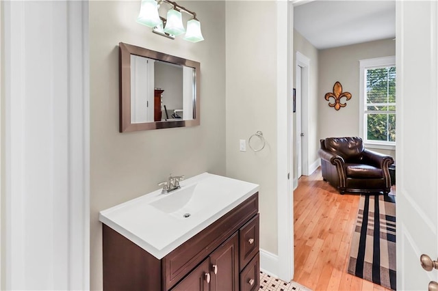 bathroom with vanity and hardwood / wood-style floors