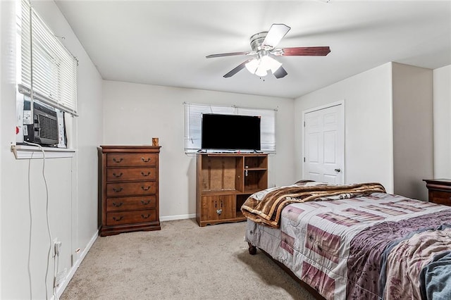 carpeted bedroom featuring cooling unit and ceiling fan