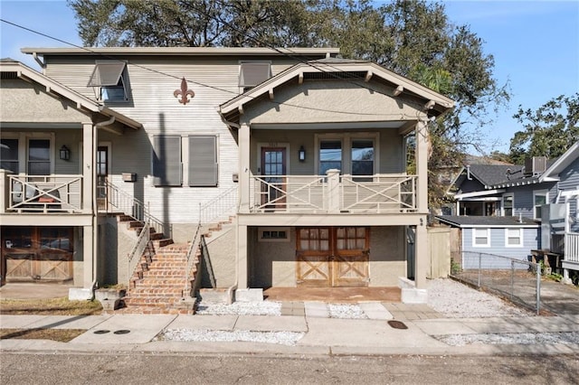 view of front of house with a garage and central AC unit