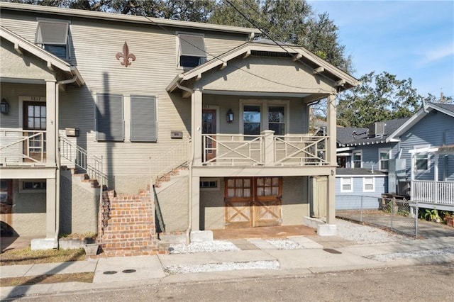 view of front of home featuring a balcony