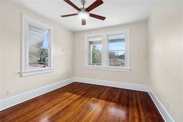 empty room featuring ceiling fan and hardwood / wood-style floors