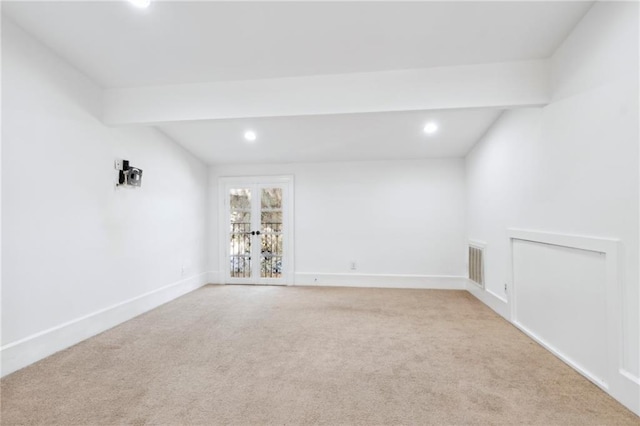 spare room with light colored carpet