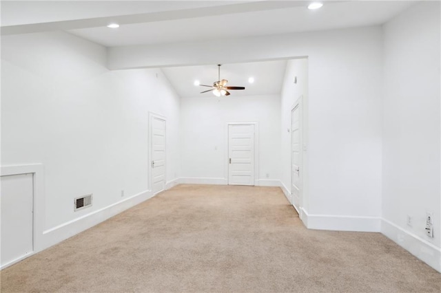 unfurnished room with ceiling fan and light carpet