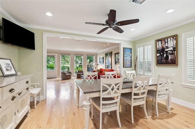 dining space featuring ceiling fan, crown molding, and light hardwood / wood-style floors