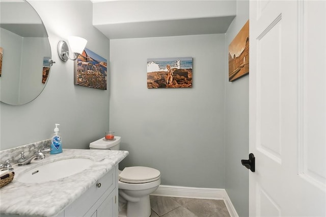 bathroom with tile patterned floors, toilet, and vanity