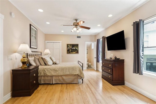 bedroom with light wood-type flooring and ceiling fan