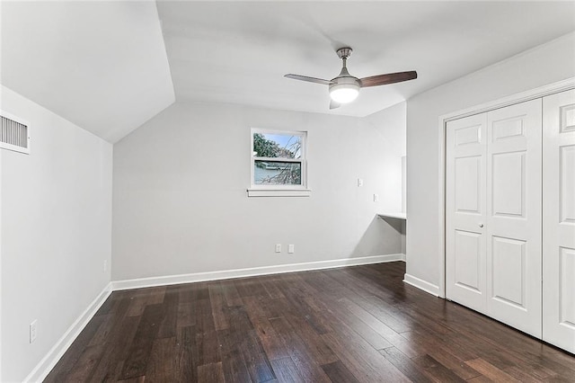 bonus room with vaulted ceiling, ceiling fan, and dark hardwood / wood-style flooring