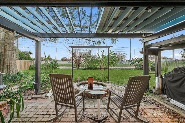 view of patio with a fire pit, grilling area, and a pergola