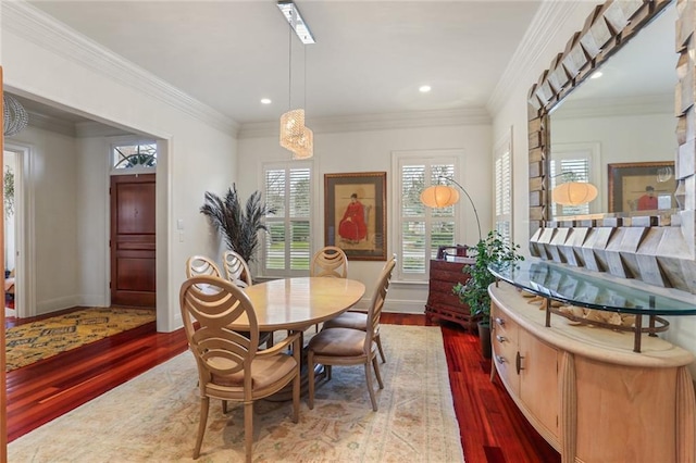 dining room with crown molding and wood-type flooring