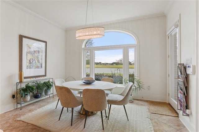 tiled dining room featuring ornamental molding, a water view, and a notable chandelier