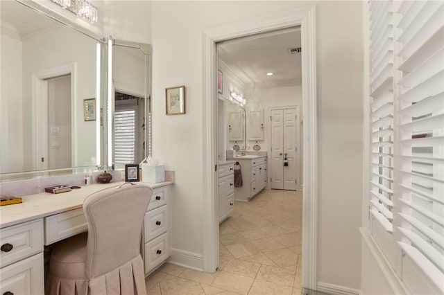 bathroom featuring vanity, tile patterned floors, and crown molding