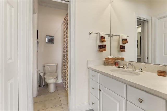 bathroom with vanity, tile patterned floors, and toilet