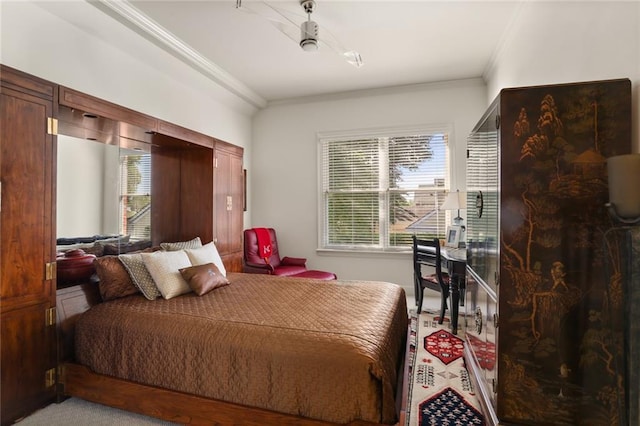 bedroom featuring crown molding