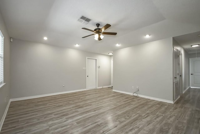 spare room featuring ceiling fan and hardwood / wood-style flooring