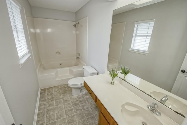 full bathroom with toilet, vanity, and shower / bath combination