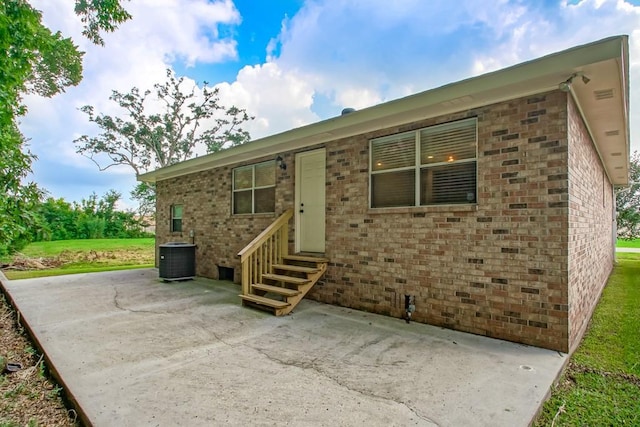 exterior space featuring central AC and a patio area