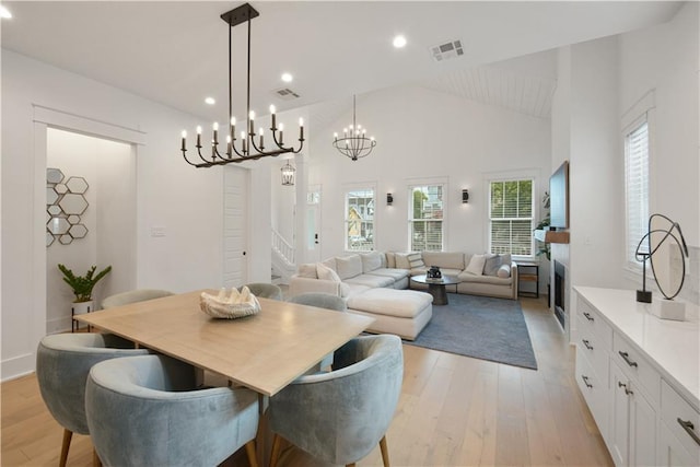 201 S Cortez St, New Orleans, LA 70119 - dining space featuring vaulted ceiling, light wood-style flooring, a chandelier, and recessed lighting
