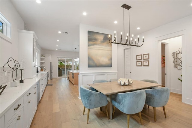 201 S Cortez St, New Orleans, LA 70119 - dining area with a chandelier, light wood-type flooring, and recessed lighting