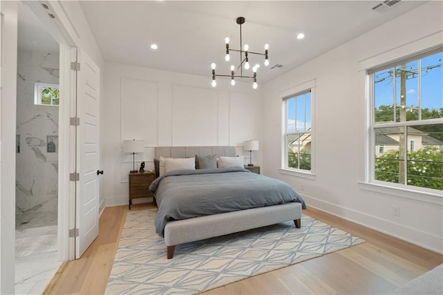 201 S Cortez St, New Orleans, LA 70119 - bedroom with multiple windows, a chandelier, light wood-type flooring, and recessed lighting