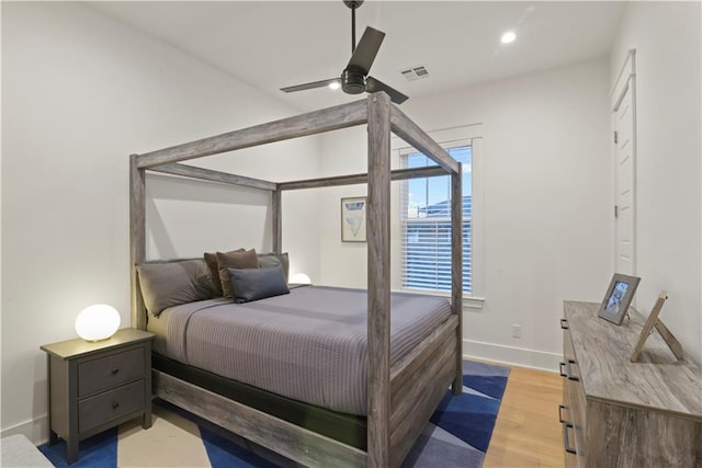 bedroom with hardwood / wood-style flooring and ceiling fan