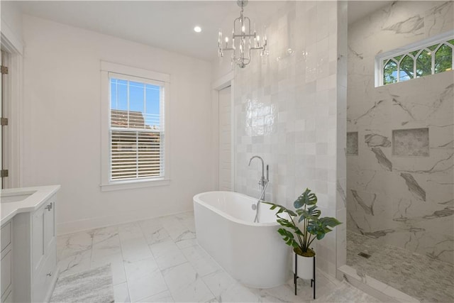 201 S Cortez St, New Orleans, LA 70119 - full bath featuring a freestanding tub, marble look tile flooring, a marble finish shower, vanity, and a chandelier