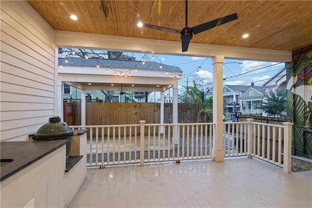 view of patio featuring area for grilling and ceiling fan