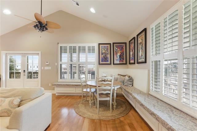 dining area featuring ceiling fan, light hardwood / wood-style flooring, and vaulted ceiling