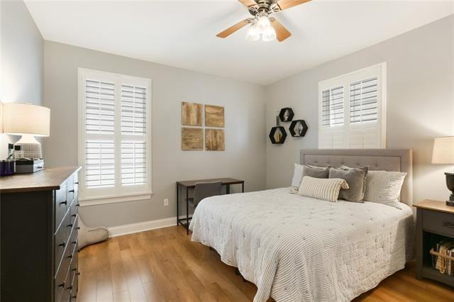 bedroom with ceiling fan and hardwood / wood-style floors